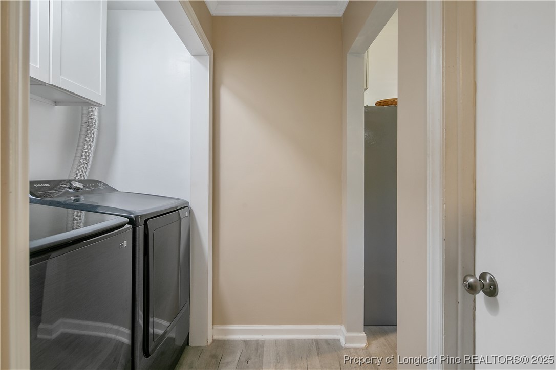 7666 Overhills Road Spring Lake, NC 28390 - Photo 24 of 50 a utility room with washing machine