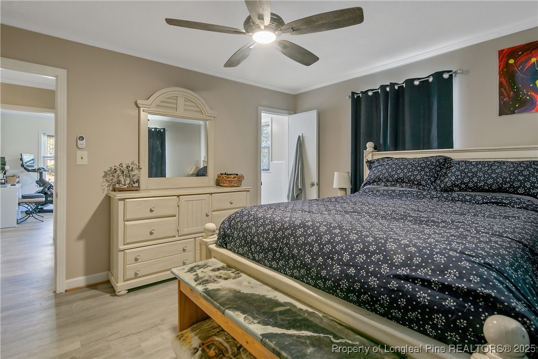 7666 Overhills Road Spring Lake, NC 28390 - Photo 29 of 50 a bedroom with a bed and a dresser