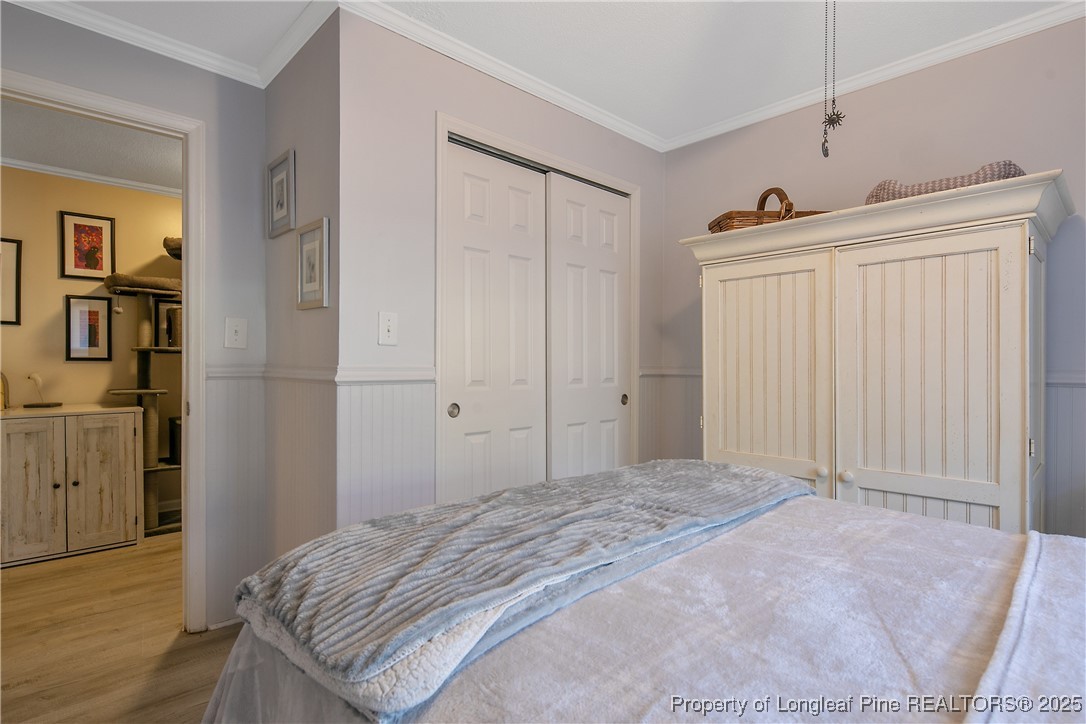 7666 Overhills Road Spring Lake, NC 28390 - Photo 35 of 50 a bedroom with a bed and a closet