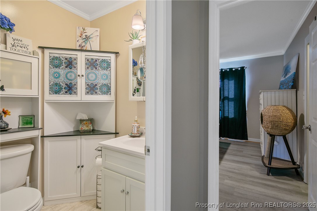 7666 Overhills Road Spring Lake, NC 28390 - Photo 37 of 50 a view of bathroom with a window and mirror