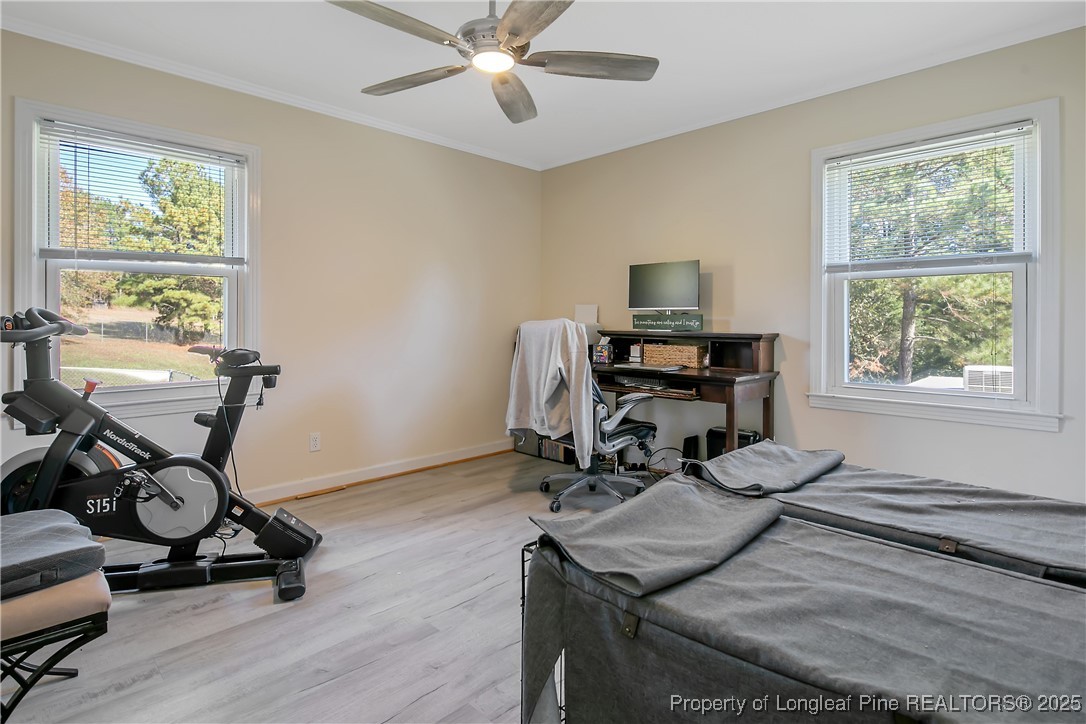 7666 Overhills Road Spring Lake, NC 28390 - Photo 38 of 50 a room with gym equipment and a window