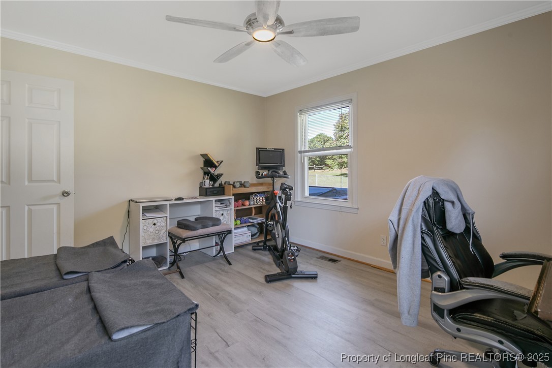 7666 Overhills Road Spring Lake, NC 28390 - Photo 41 of 50 a view of a workspace with furniture and a window