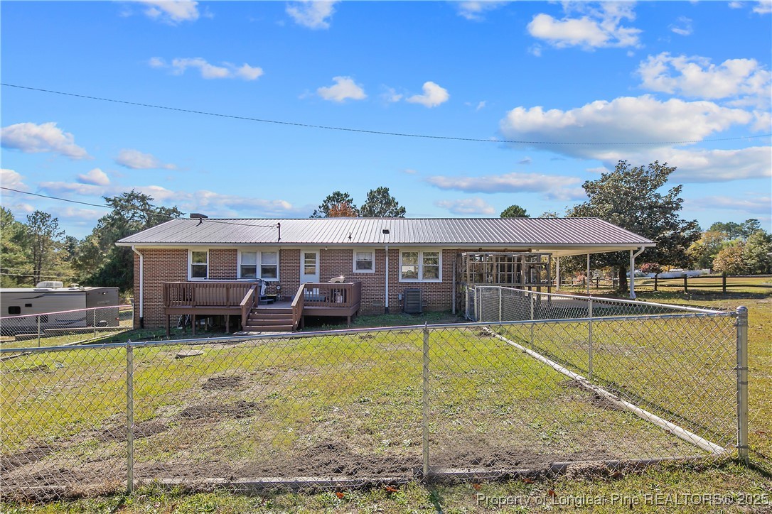 7666 Overhills Road Spring Lake, NC 28390 - Photo 46 of 50 a view of a house with swimming pool and sitting area
