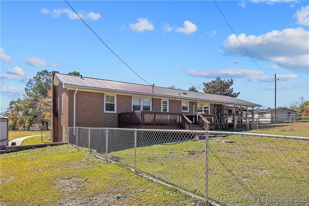 7666 Overhills Road Spring Lake, NC 28390 - Photo 47 of 50 a view of a house with swimming pool