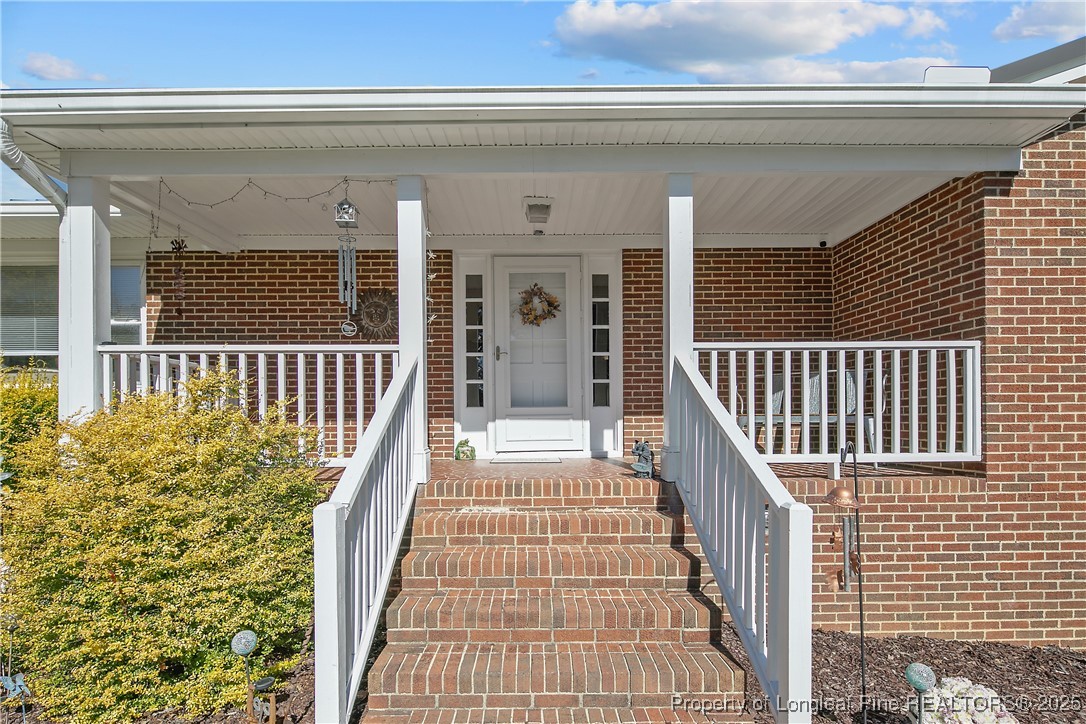 7666 Overhills Road Spring Lake, NC 28390 - Photo 5 of 50 a view of a balcony with wooden floor
