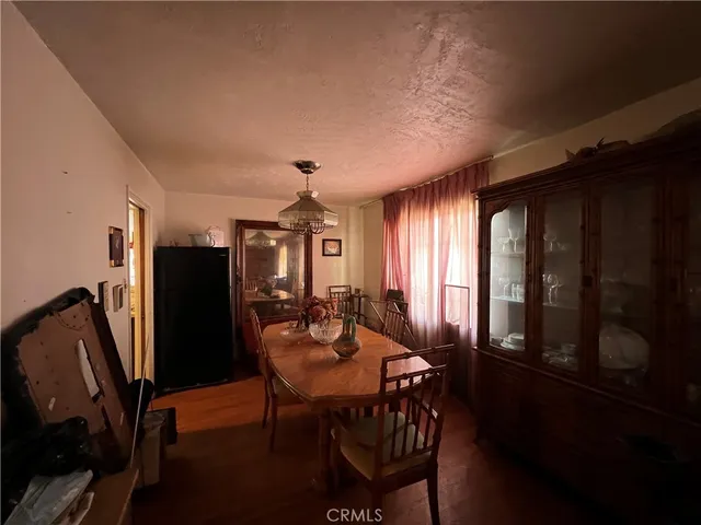 a view of a dining room with furniture and window