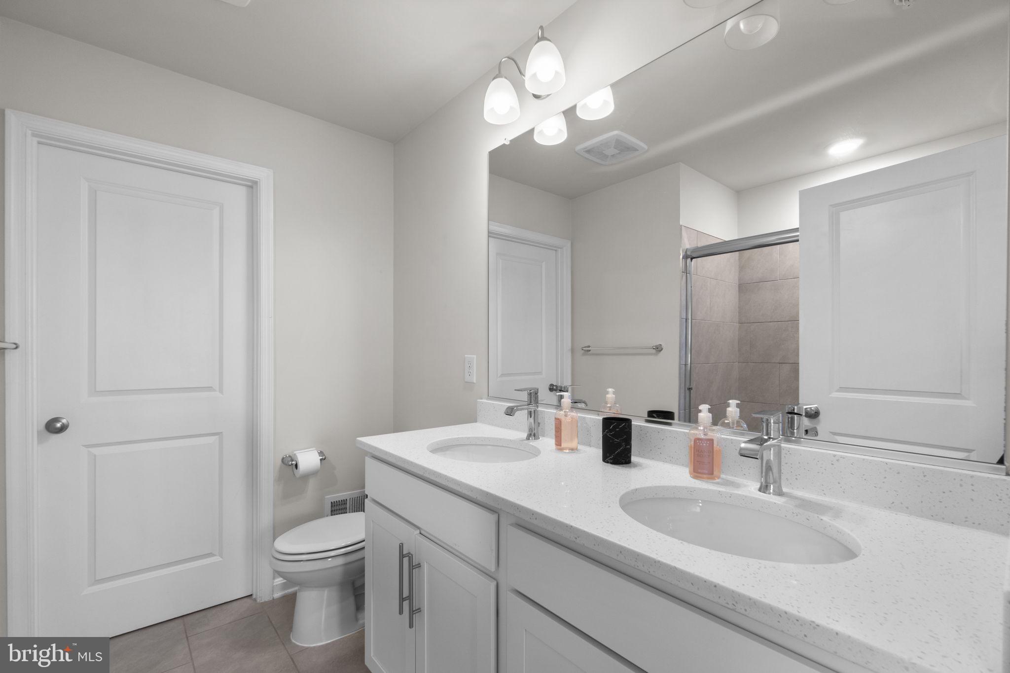 417 Union Street Frederick, MD 21701 - Photo 19 of 35 Modern dual-sink bathroom oasis.