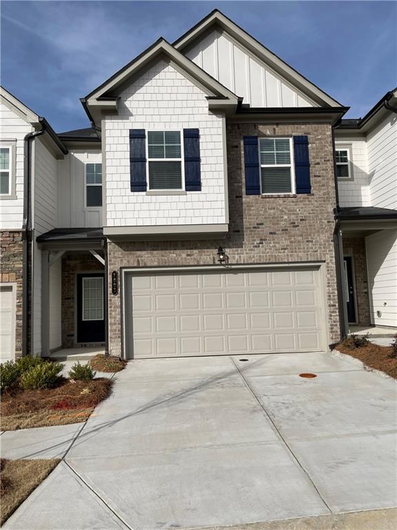 1003 Ramon Drive Grayson, GA 30017 - Photo 1 of 12 a front view of a house with yard