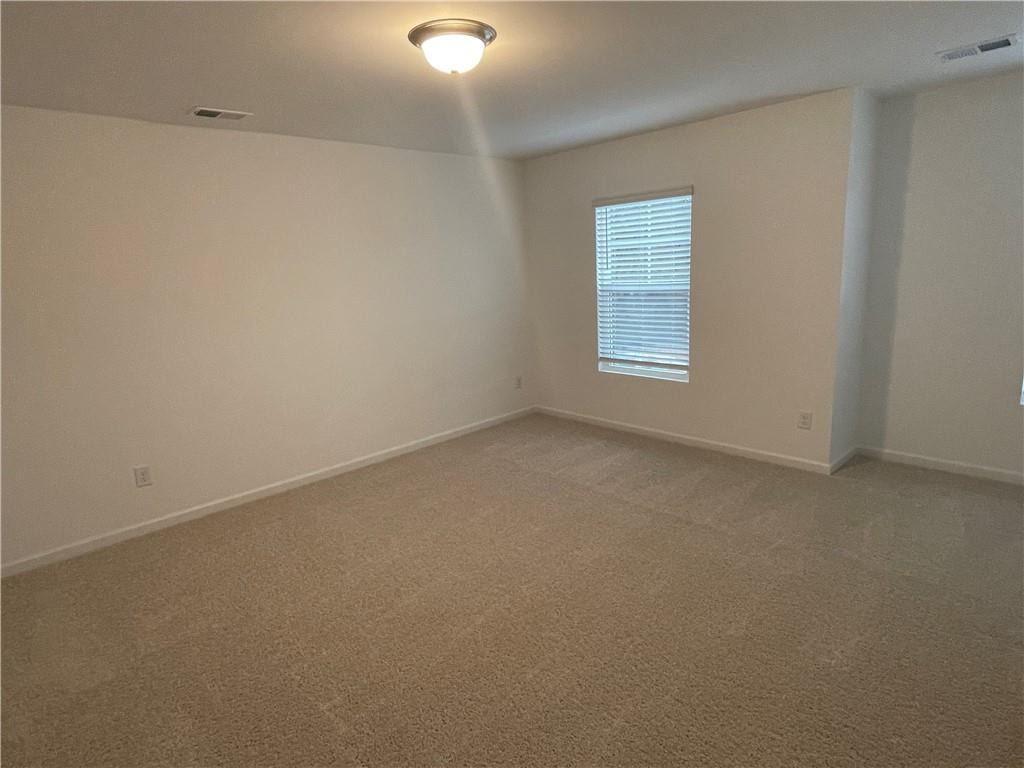 1003 Ramon Drive Grayson, GA 30017 - Photo 9 of 12 a view of an empty room with a window