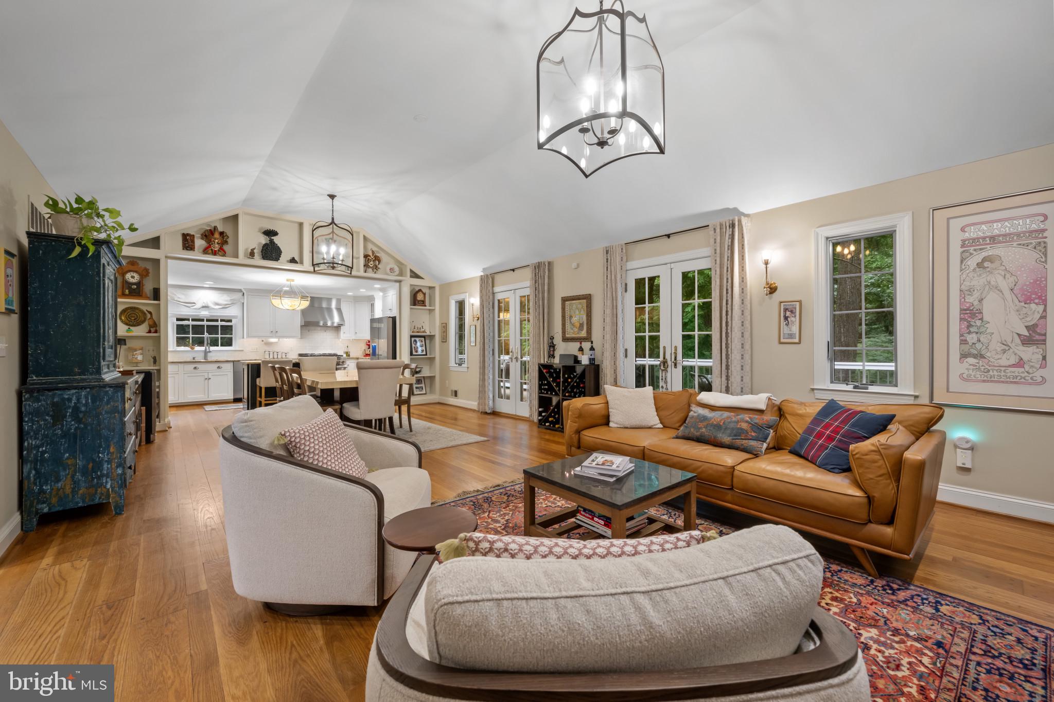 901 Navy Road Baltimore, MD 21204 - Photo 1 of 40 a living room with furniture a chandelier and a flat screen tv