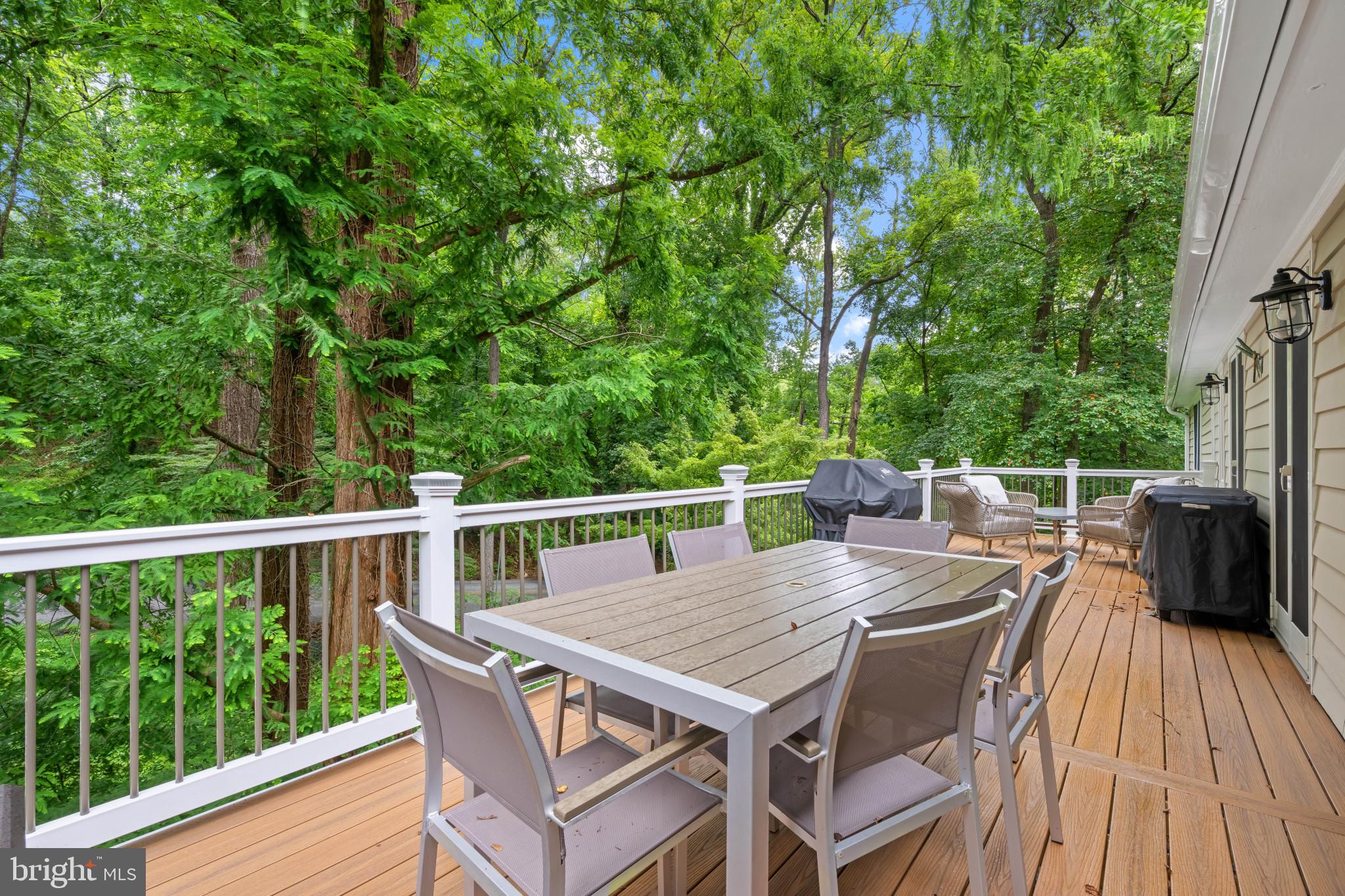 901 Navy Road Baltimore, MD 21204 - Photo 13 of 40 a balcony with wooden floor table and chairs