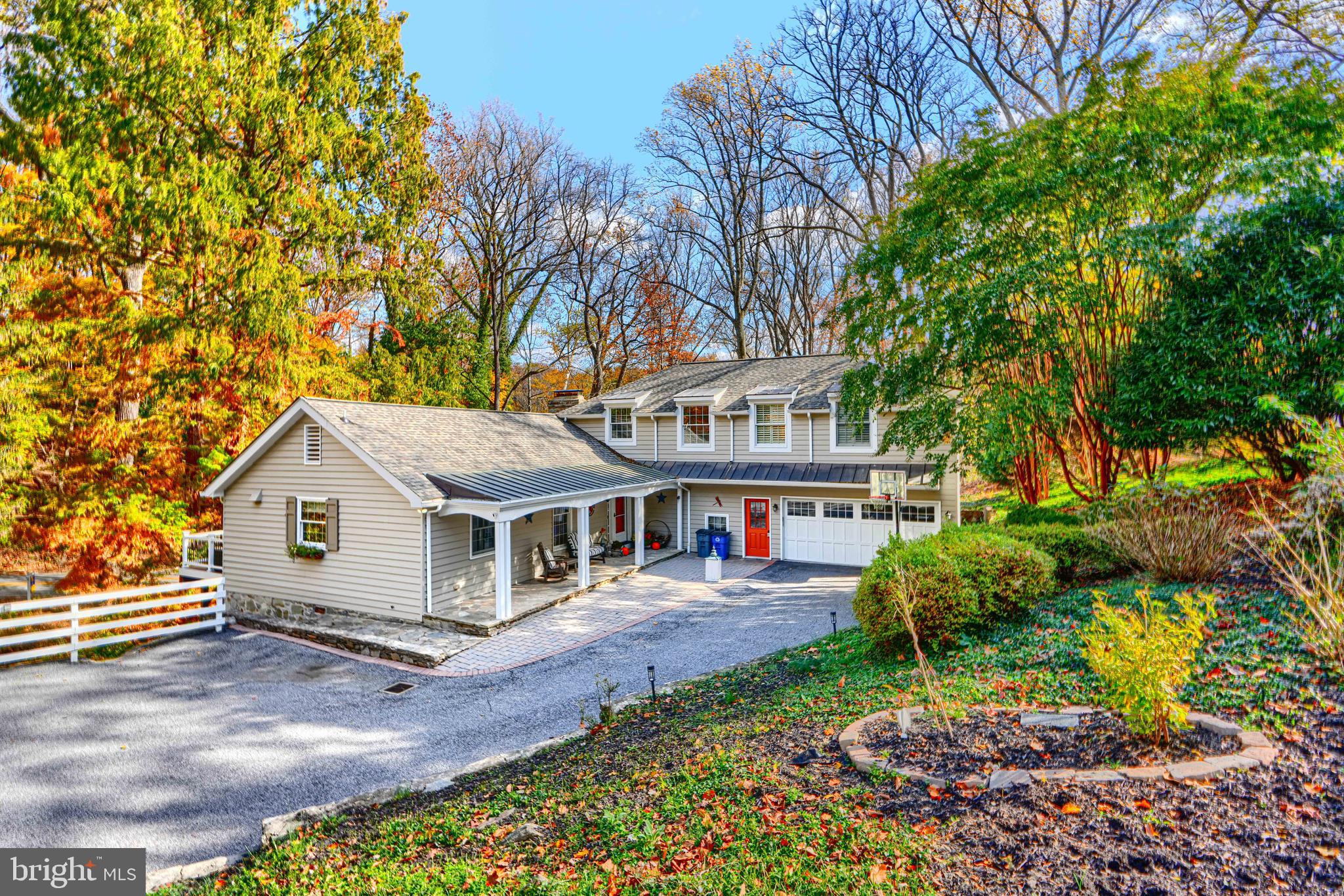 901 Navy Road Baltimore, MD 21204 - Photo 2 of 40 a front view of a house with a garden and trees