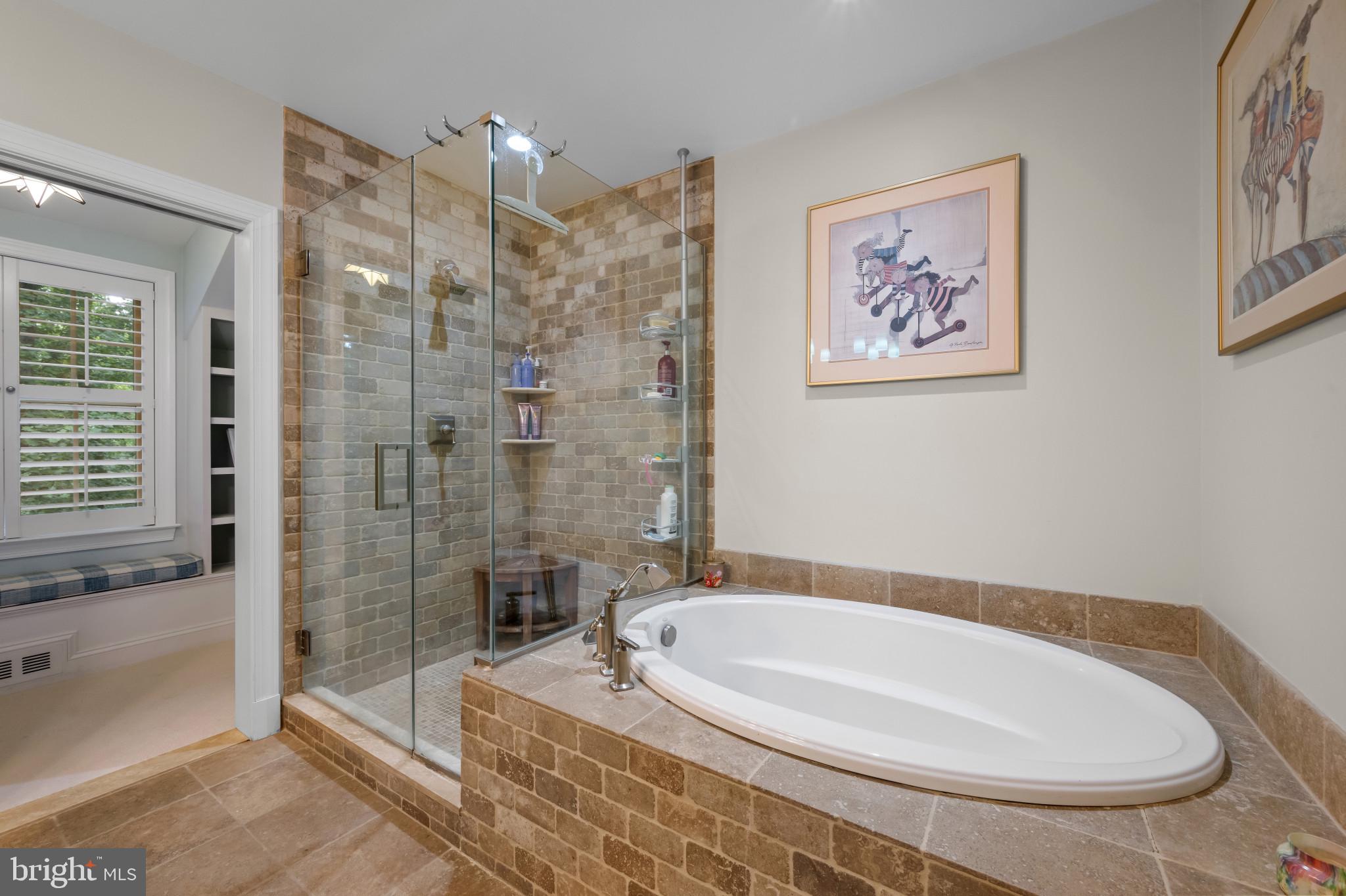 901 Navy Road Baltimore, MD 21204 - Photo 24 of 40 a bathroom with a bathtub and a shower