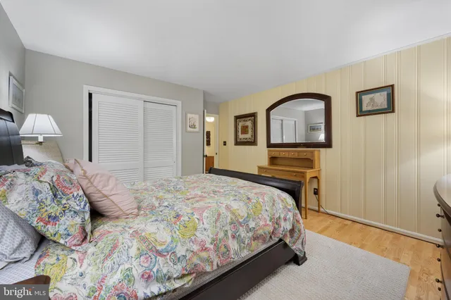 a view of a room with furniture and wooden floor