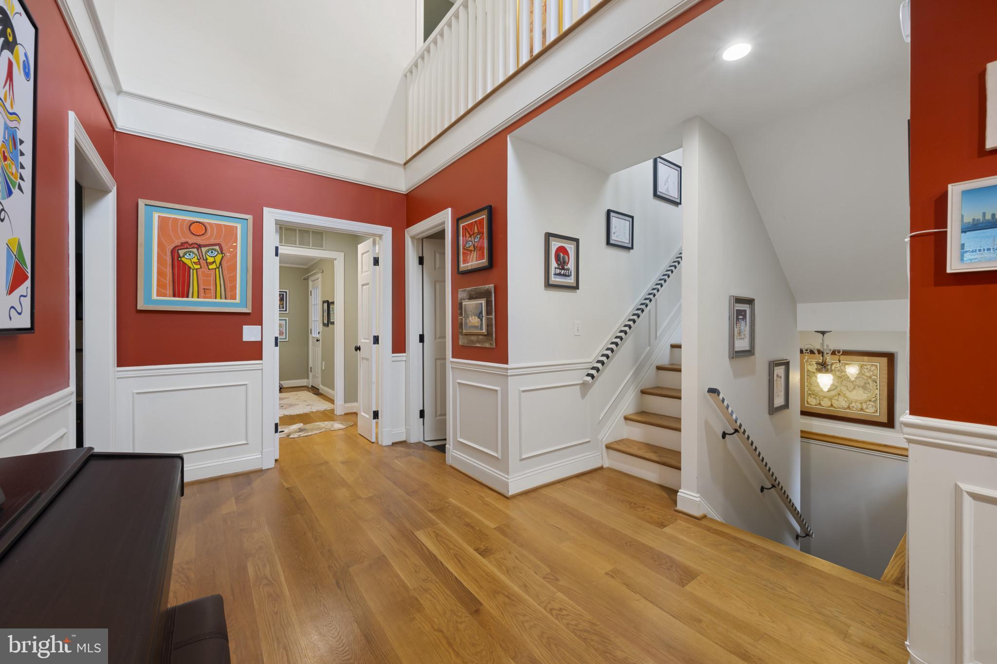 901 Navy Road Baltimore, MD 21204 - Photo 6 of 40 a view of entryway with stairs and wooden floor