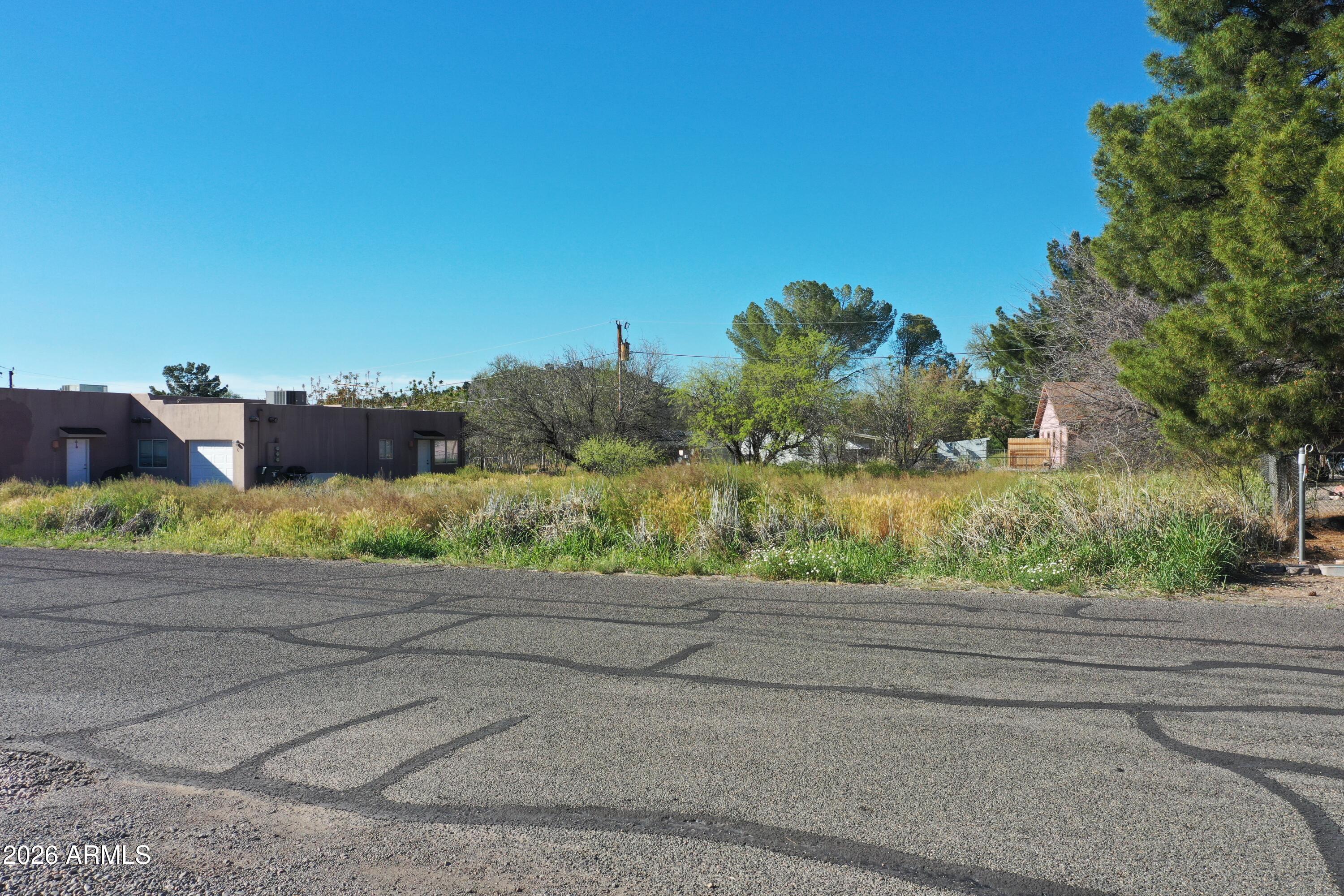 3980 East Valley Lane, Unit 32 Rimrock, AZ 86335 - Photo 1 of 11 a street view with large trees