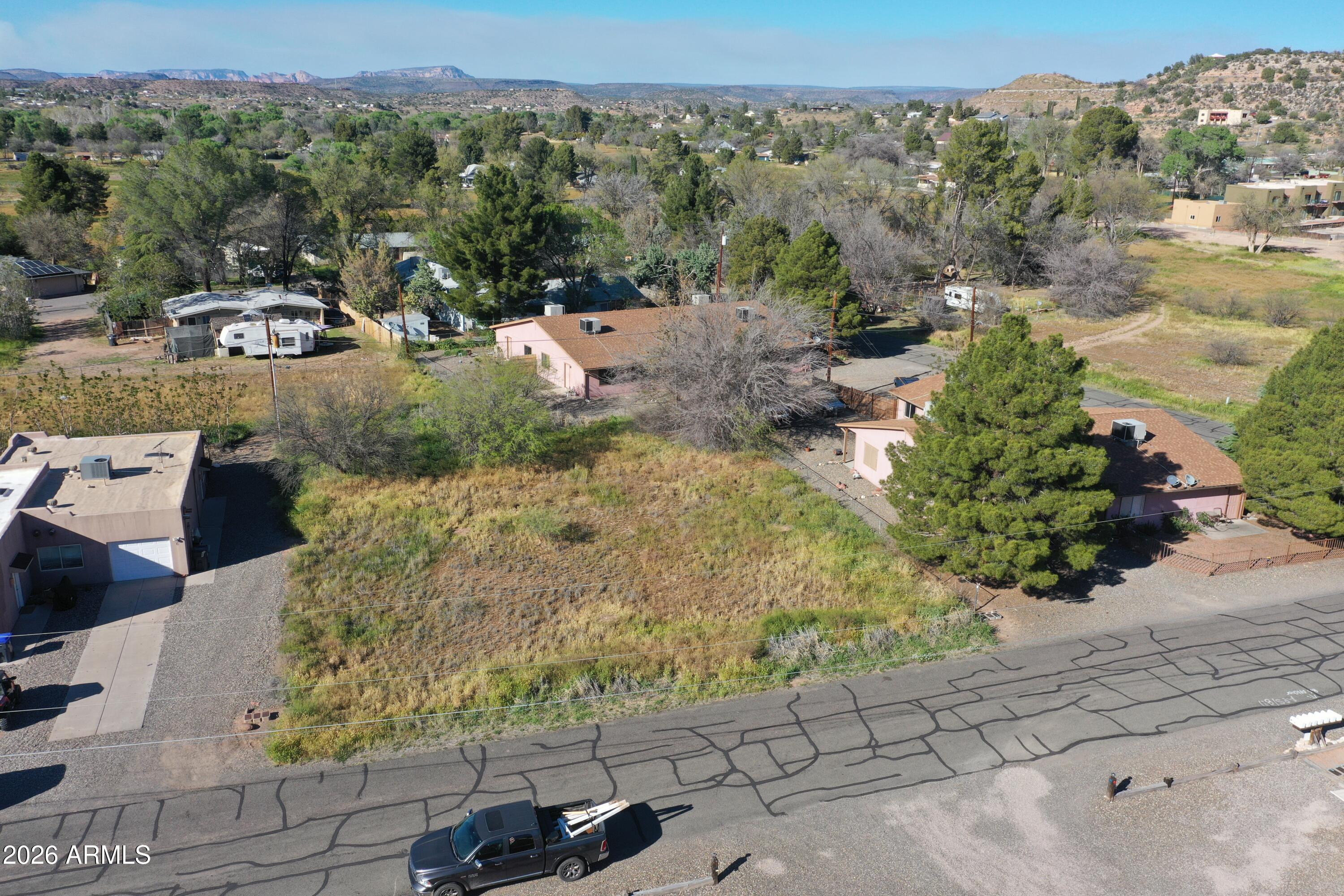3980 East Valley Lane, Unit 32 Rimrock, AZ 86335 - Photo 3 of 11 a view of a garden with mountains in the background