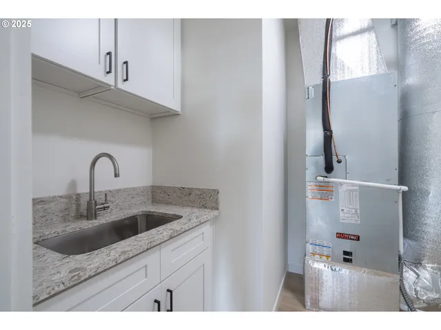 a bathroom with a shower and a glass door