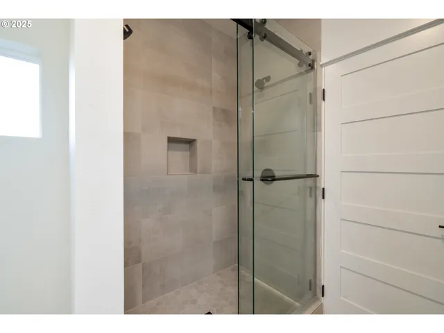 a bathroom with a granite countertop sink a mirror and vanity