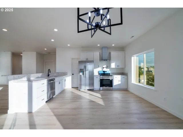 a kitchen with a sink a counter and cabinets