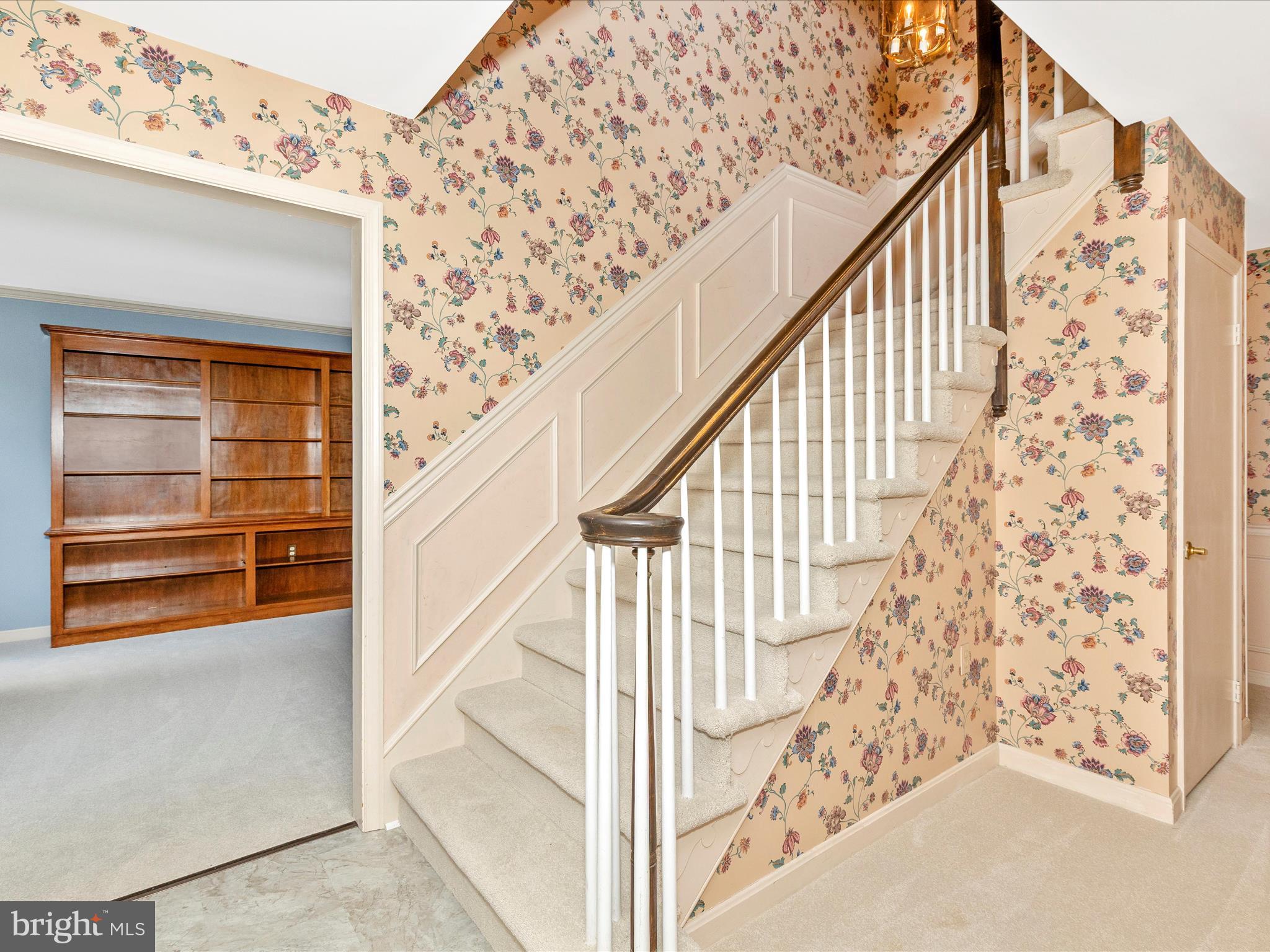 8107 Clearfield Road Frederick, MD 21702 - Photo 4 of 52 a view of staircase with wooden floor and white walls