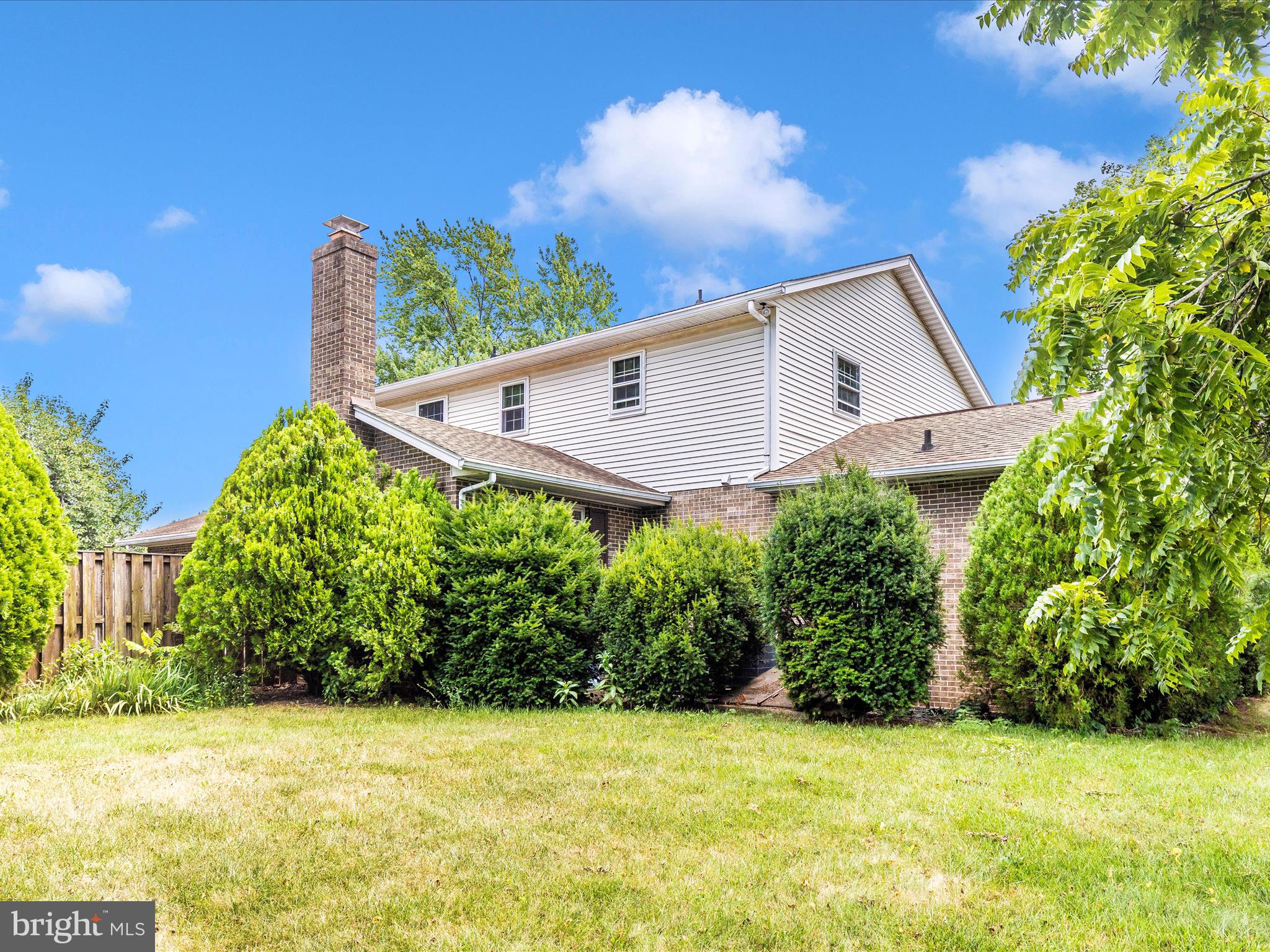 8107 Clearfield Road Frederick, MD 21702 - Photo 46 of 52 a view of a house with a yard and potted plants