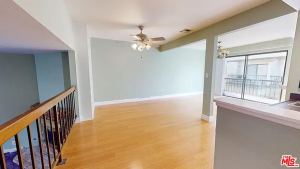 a kitchen with sink and cabinets