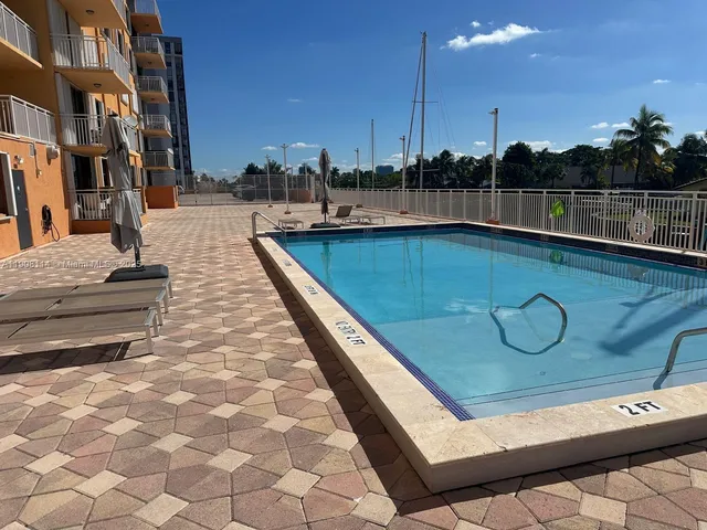 a view of swimming pool with chairs