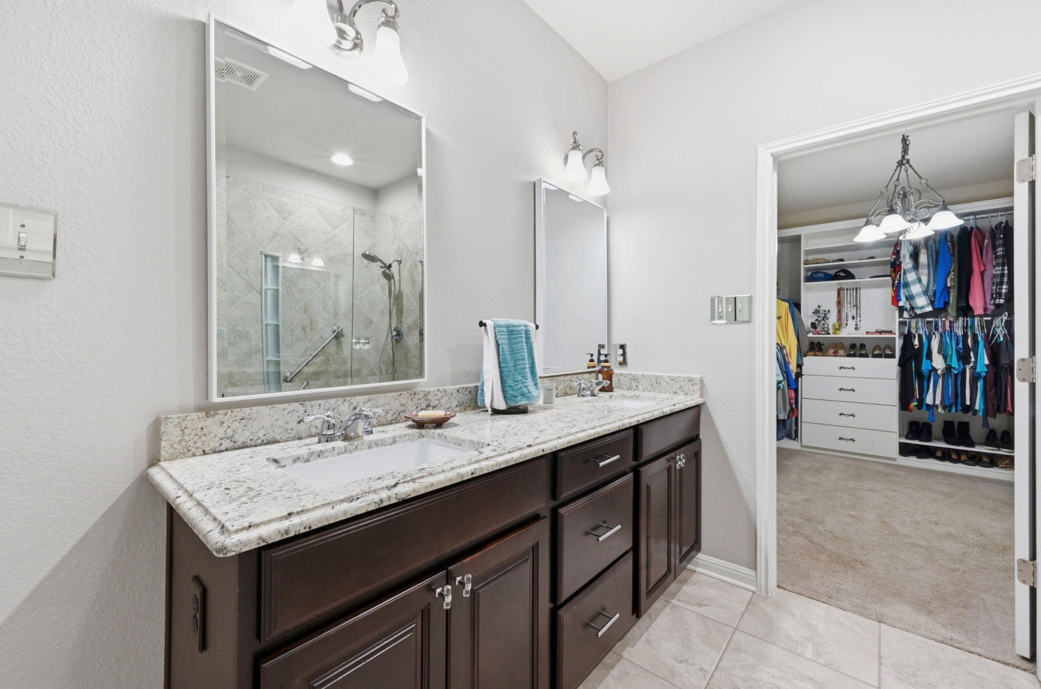 194 Treehaven Court Buda, TX 78610 - Photo 15 of 37 a bathroom with a sink double vanity and shower