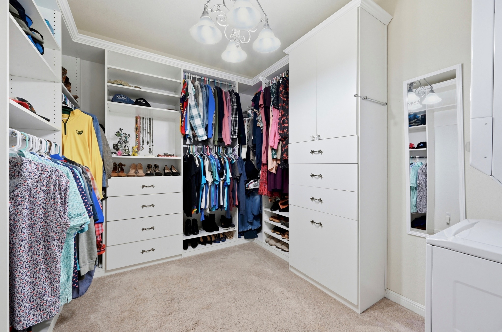 194 Treehaven Court Buda, TX 78610 - Photo 16 of 37 a view of walk in closet with clothes