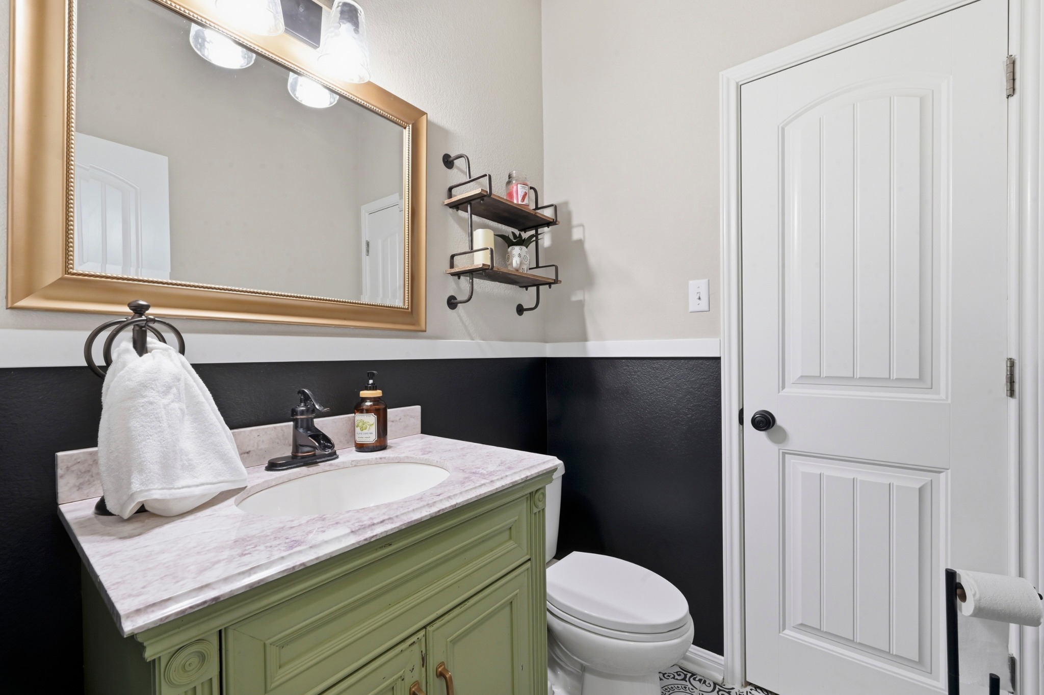 194 Treehaven Court Buda, TX 78610 - Photo 18 of 37 a bathroom with a granite countertop sink and a toilet