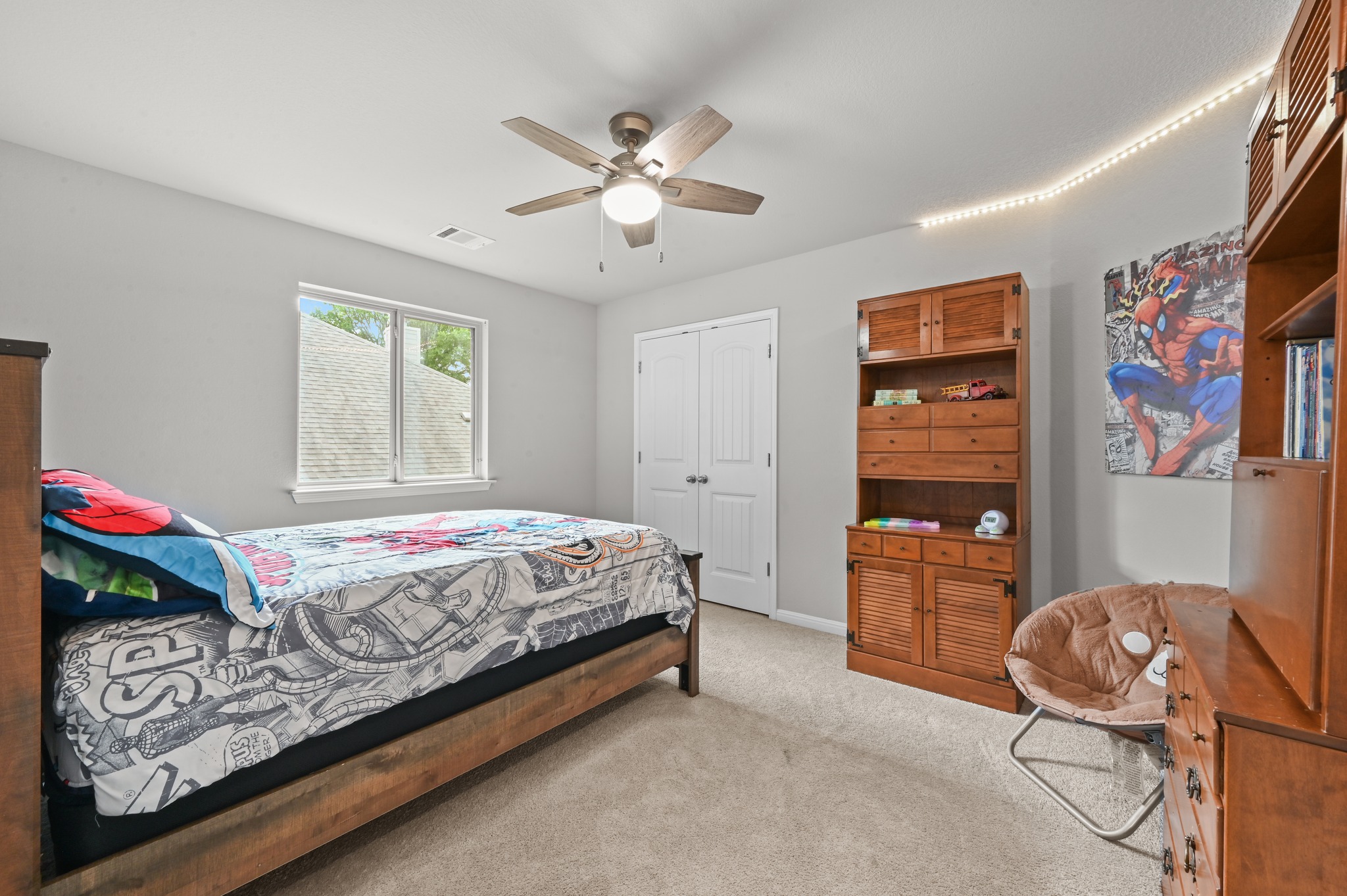 194 Treehaven Court Buda, TX 78610 - Photo 22 of 37 a bedroom with a bed and dresser