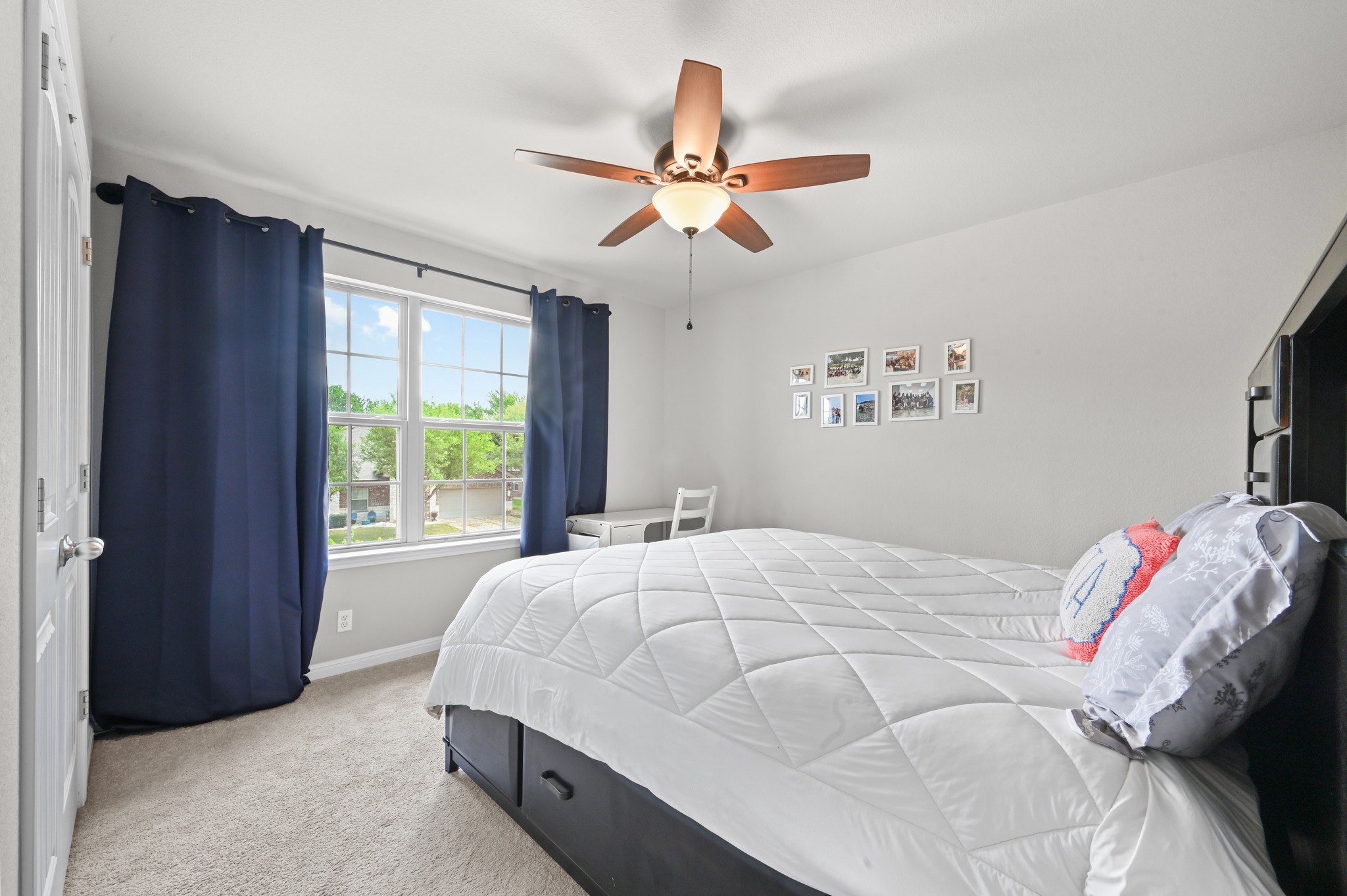 194 Treehaven Court Buda, TX 78610 - Photo 24 of 37 a bedroom with a bed and a window