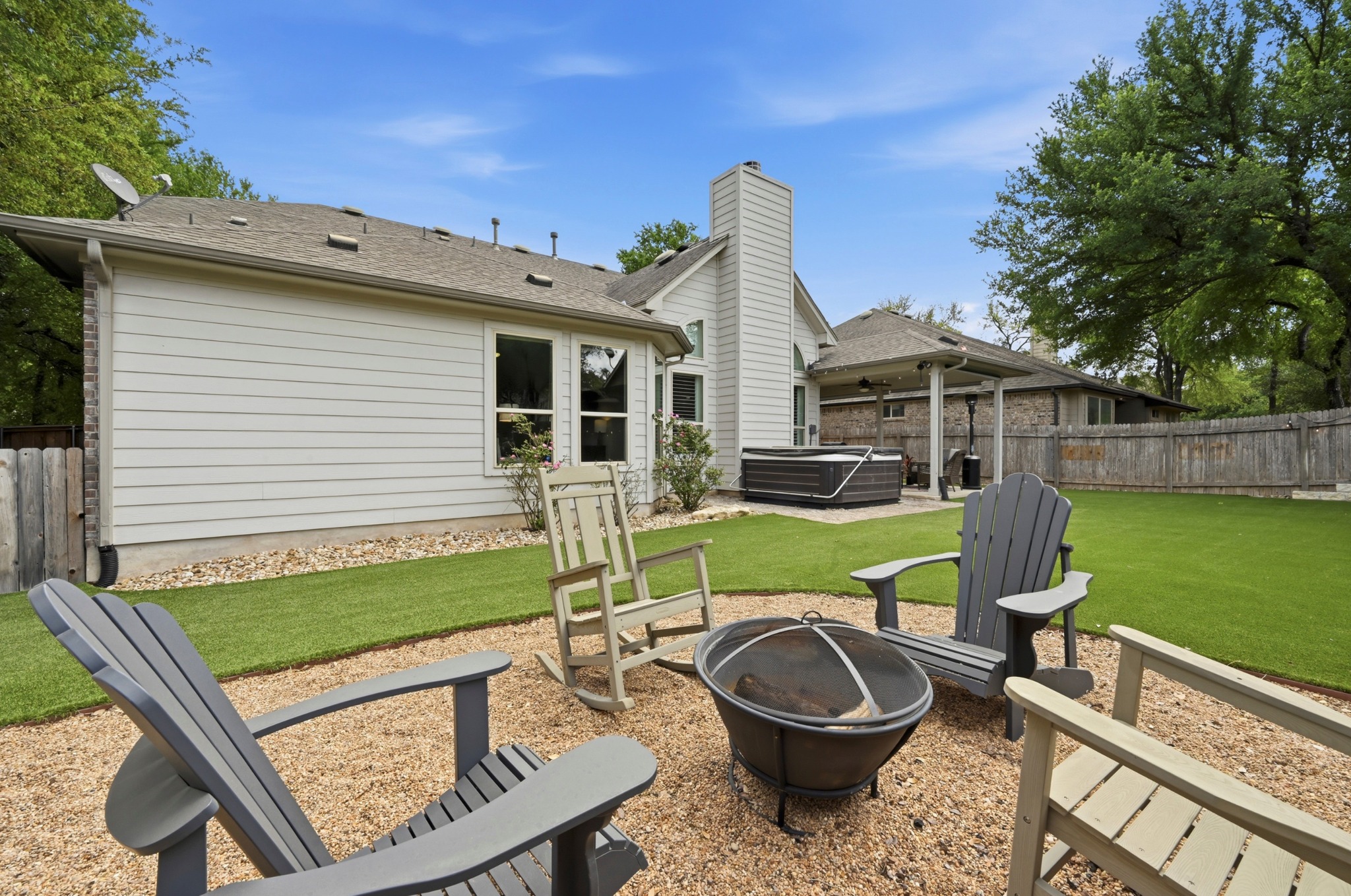 194 Treehaven Court Buda, TX 78610 - Photo 32 of 37 a view of a backyard with plants and a patio