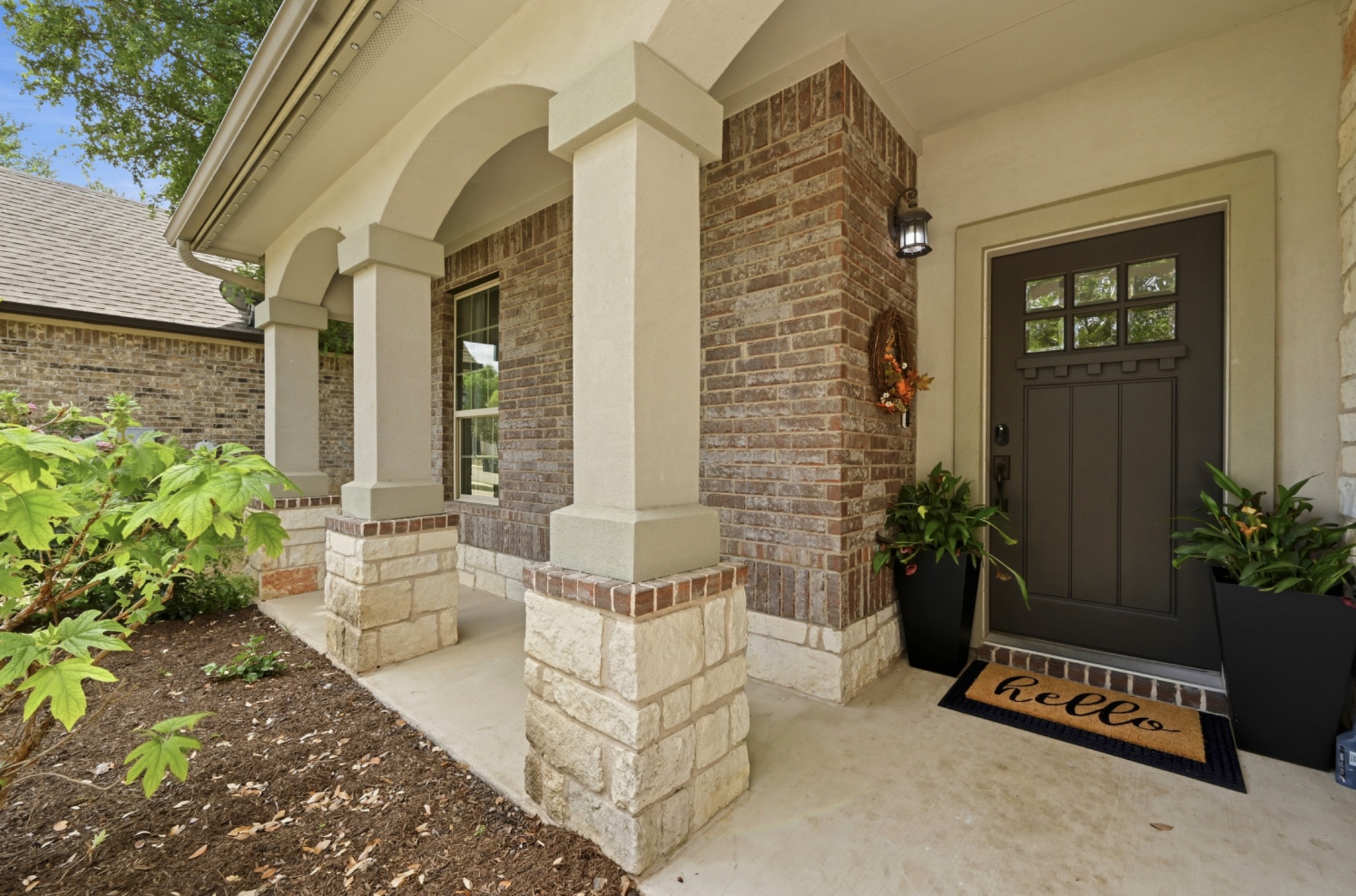 194 Treehaven Court Buda, TX 78610 - Photo 36 of 37 a building outdoor space with patio furniture and potted plants