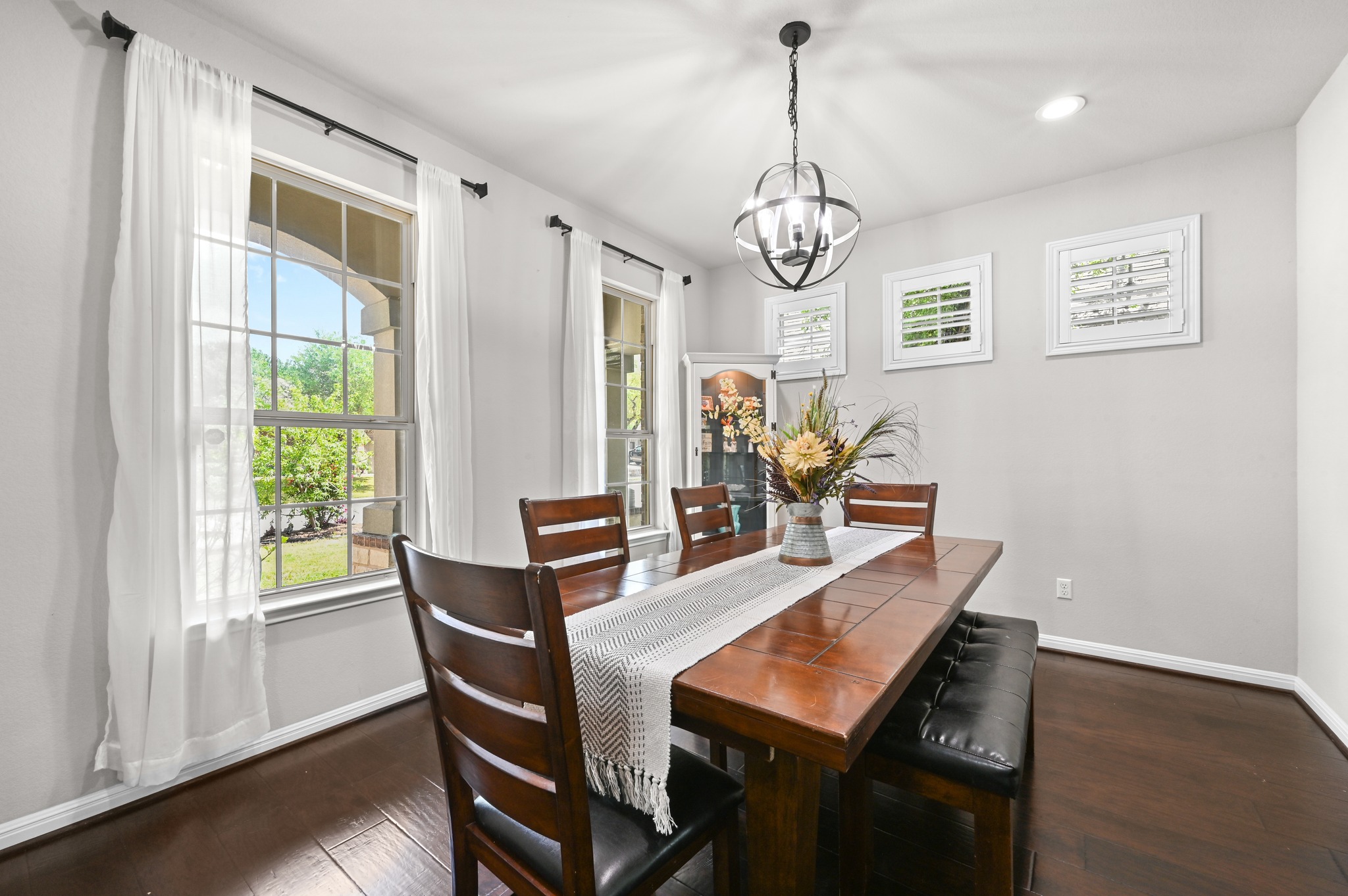 194 Treehaven Court Buda, TX 78610 - Photo 5 of 37 a view of a dining room with furniture window and wooden floor