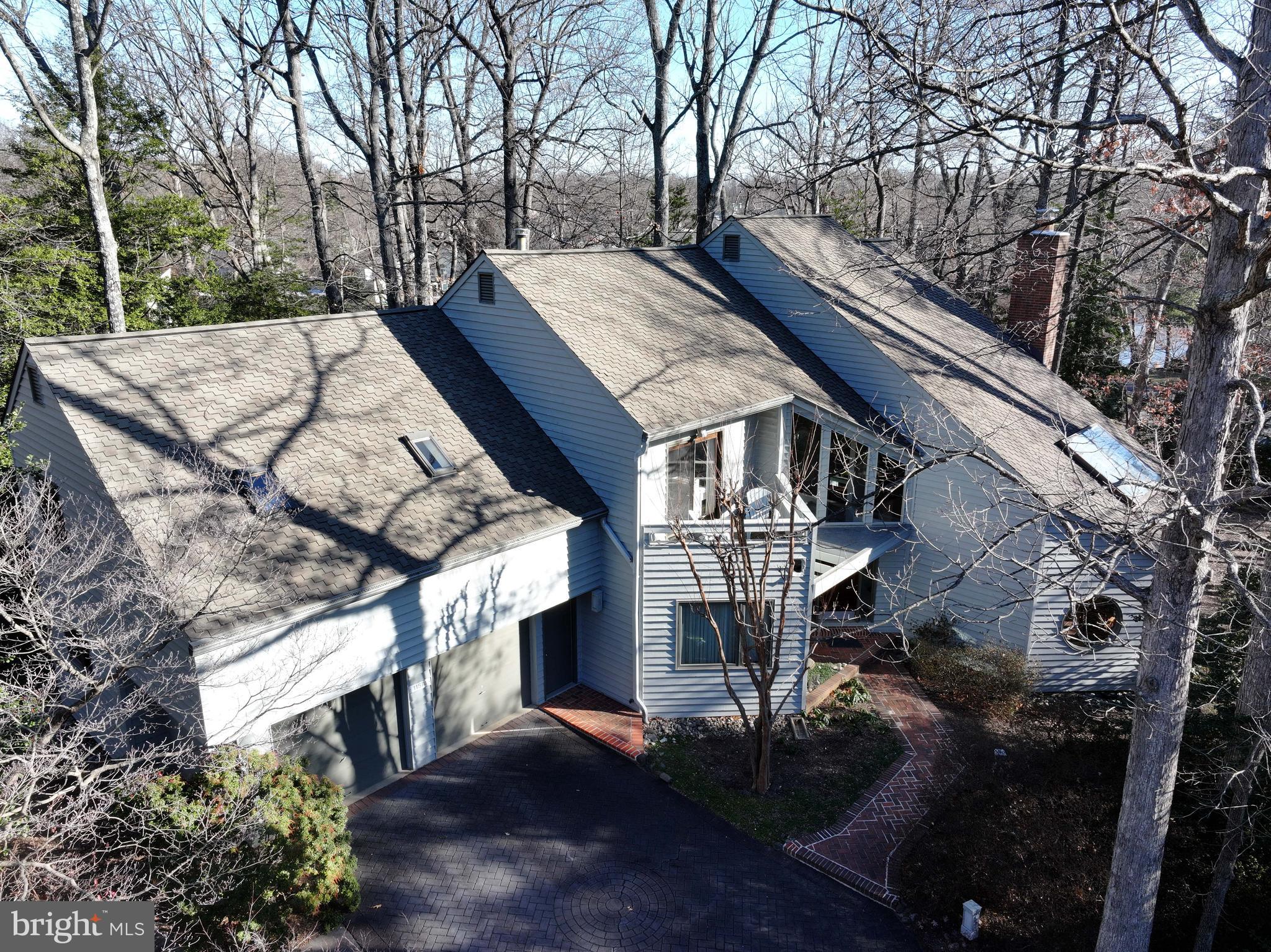 11574 Lake Newport Road Reston, VA 20194 - Photo 2 of 63 a view of a house with a yard and roof