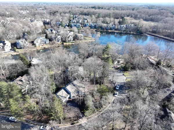 an aerial view of a houses with a lake view
