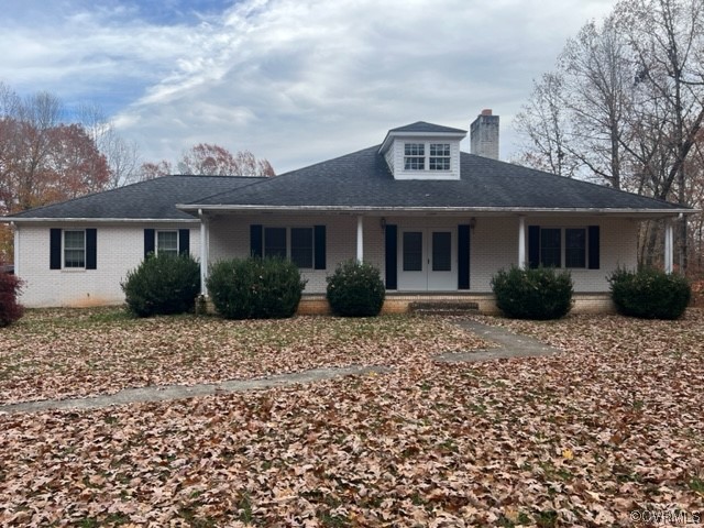 168 Hall Road Buckingham, VA 23921 - Photo 1 of 20 a front view of a house with a garden