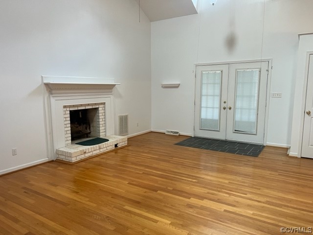 168 Hall Road Buckingham, VA 23921 - Photo 5 of 20 a view of empty room with wooden floor and fireplace