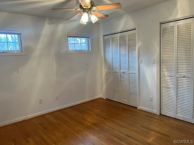 168 Hall Road Buckingham, VA 23921 - Photo 6 of 20 an empty room with wooden floor fan and windows