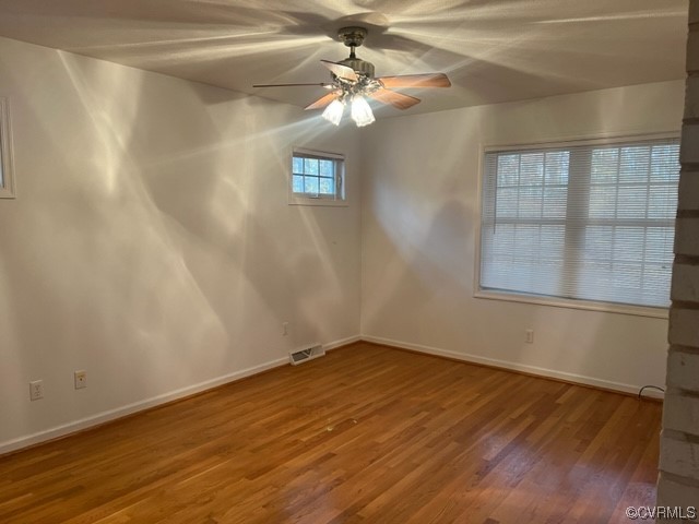 168 Hall Road Buckingham, VA 23921 - Photo 7 of 20 a view of an empty room with wooden floor and a window