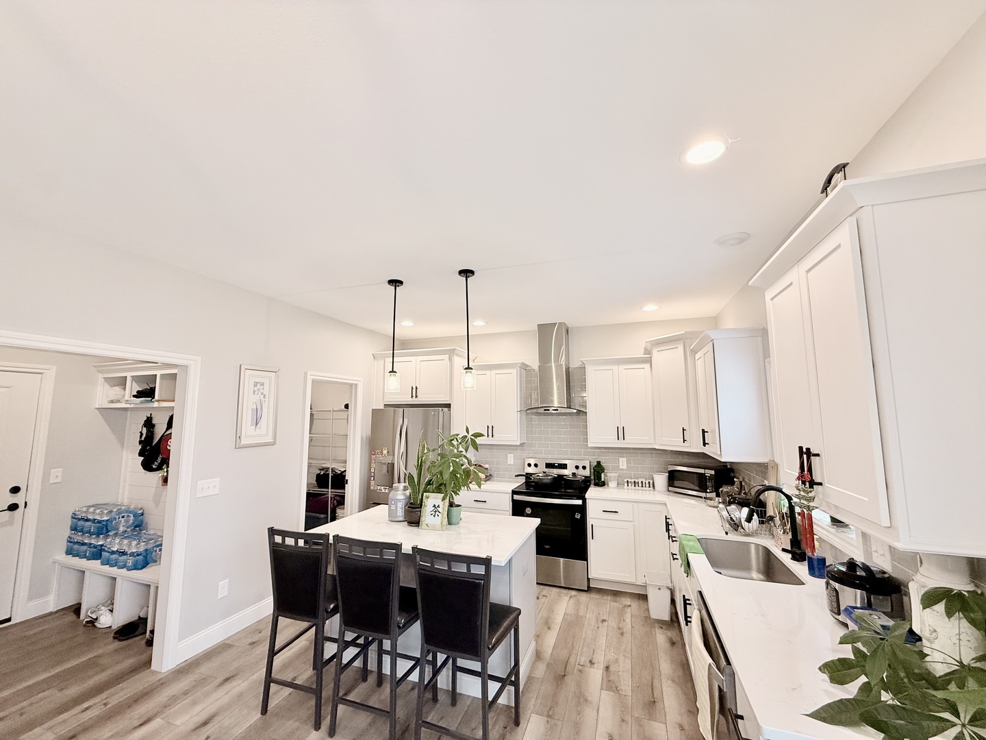 715 Rapp Drive Mahomet, IL 61853 - Photo 14 of 40 a kitchen with a table chairs stove and white cabinets