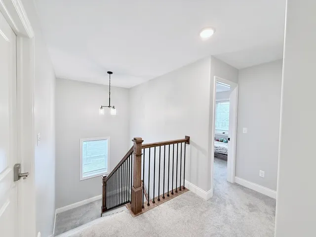 a view of a hallway to a bedroom