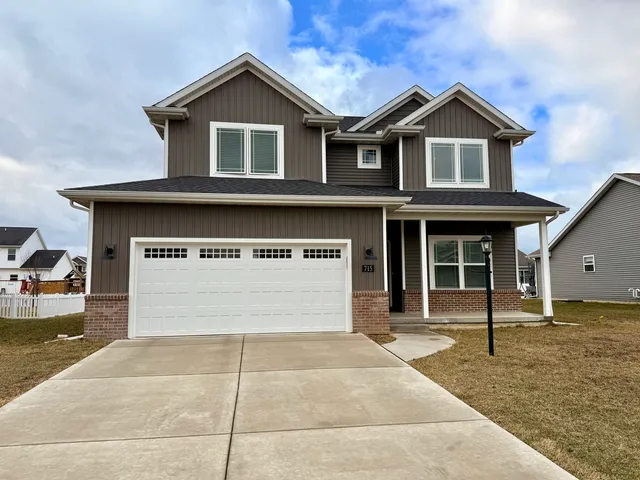 a front view of a house with a garage