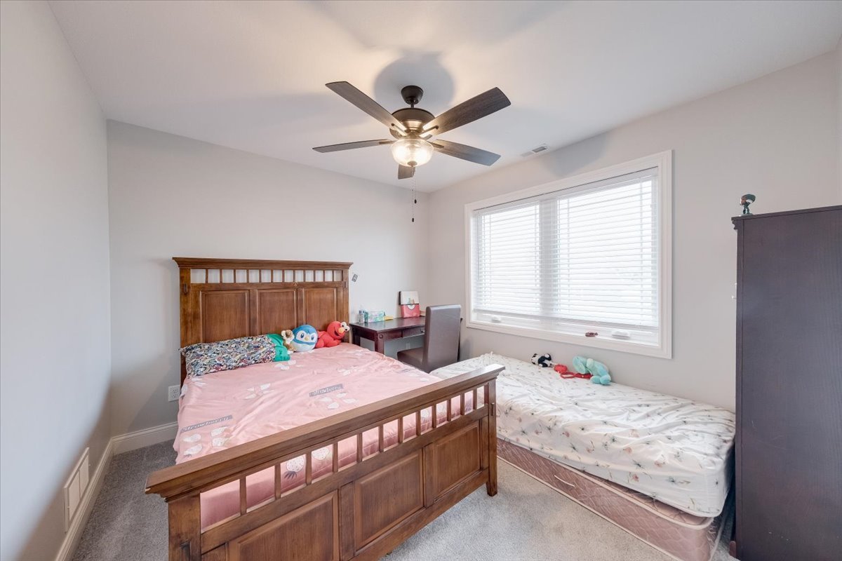 715 Rapp Drive Mahomet, IL 61853 - Photo 27 of 40 a bedroom with a bed and window