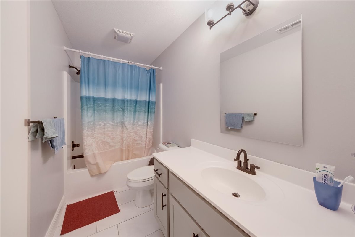 715 Rapp Drive Mahomet, IL 61853 - Photo 29 of 40 a bathroom with a sink a toilet and shower