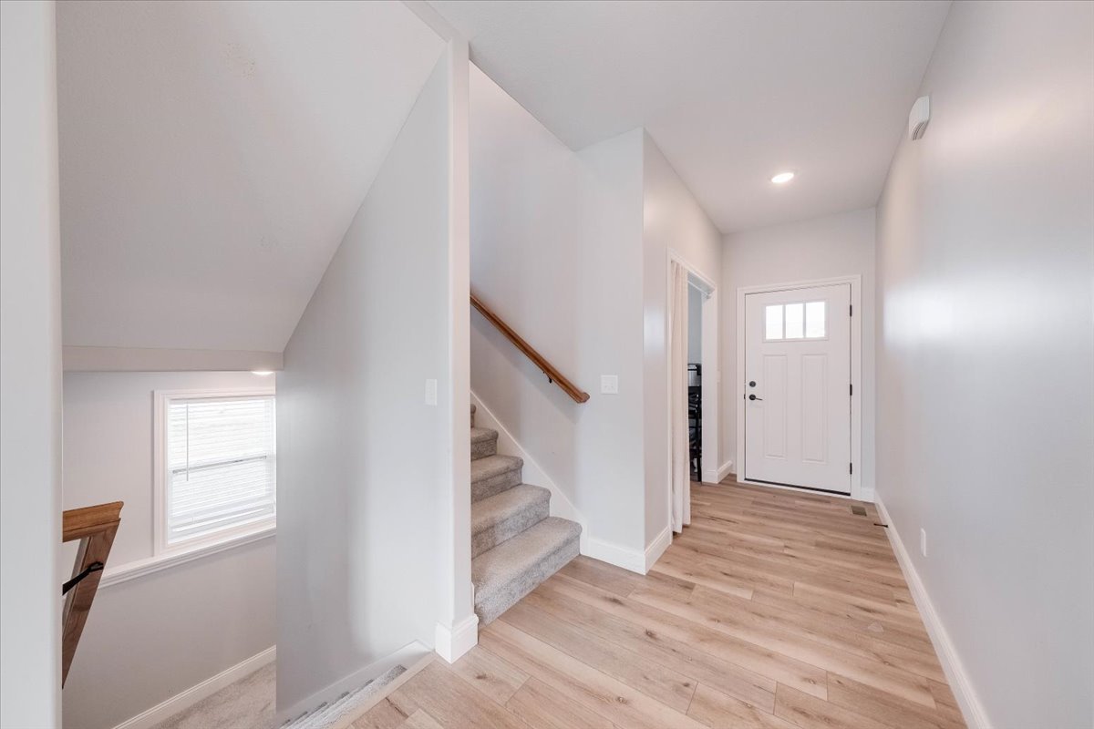 715 Rapp Drive Mahomet, IL 61853 - Photo 5 of 40 a view of an entryway with wooden floor and staircase