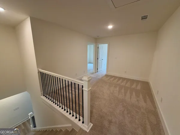 a view of entryway with stairs