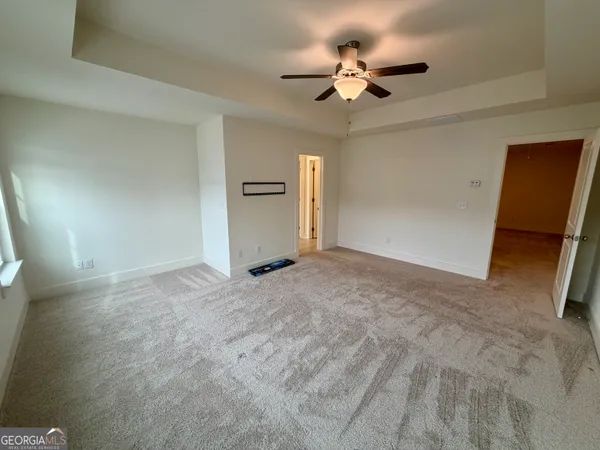 a view of a livingroom with a ceiling fan